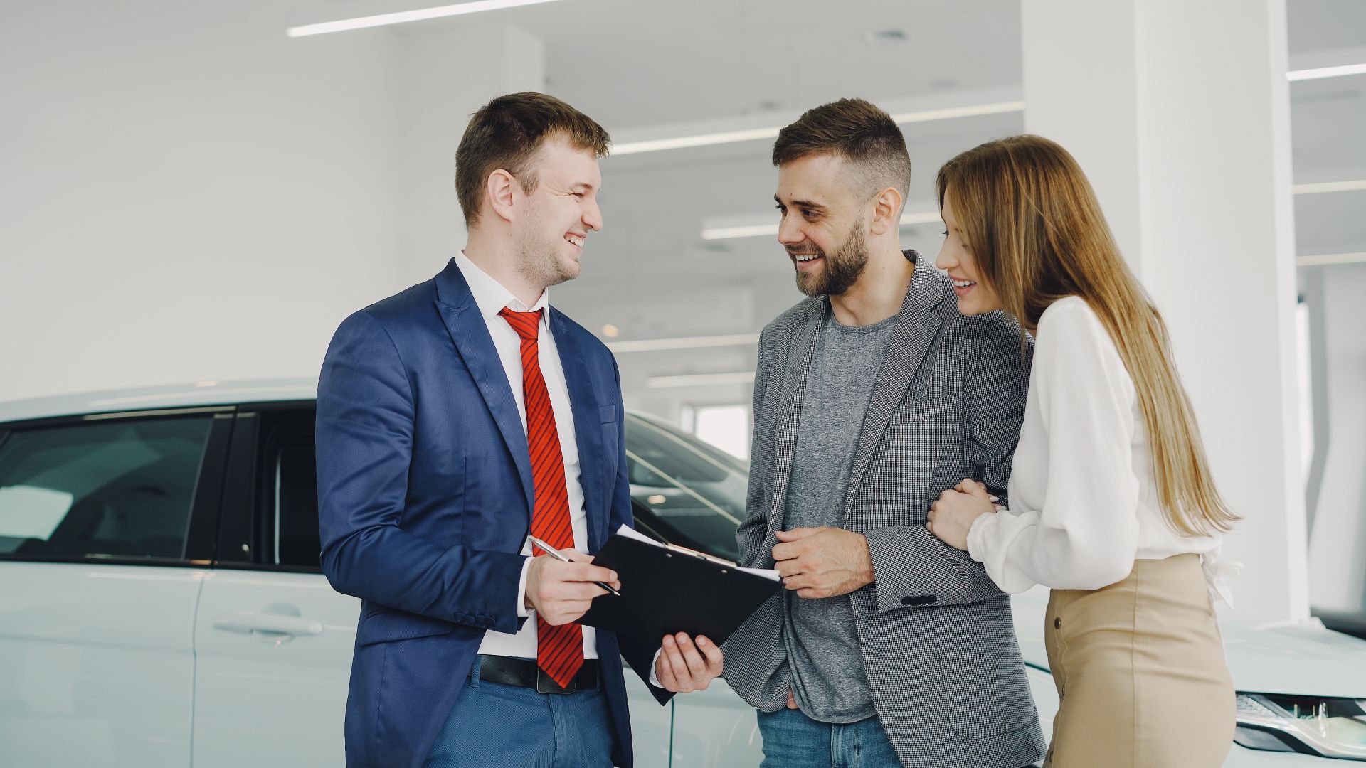 Dealership advisor talking with customers