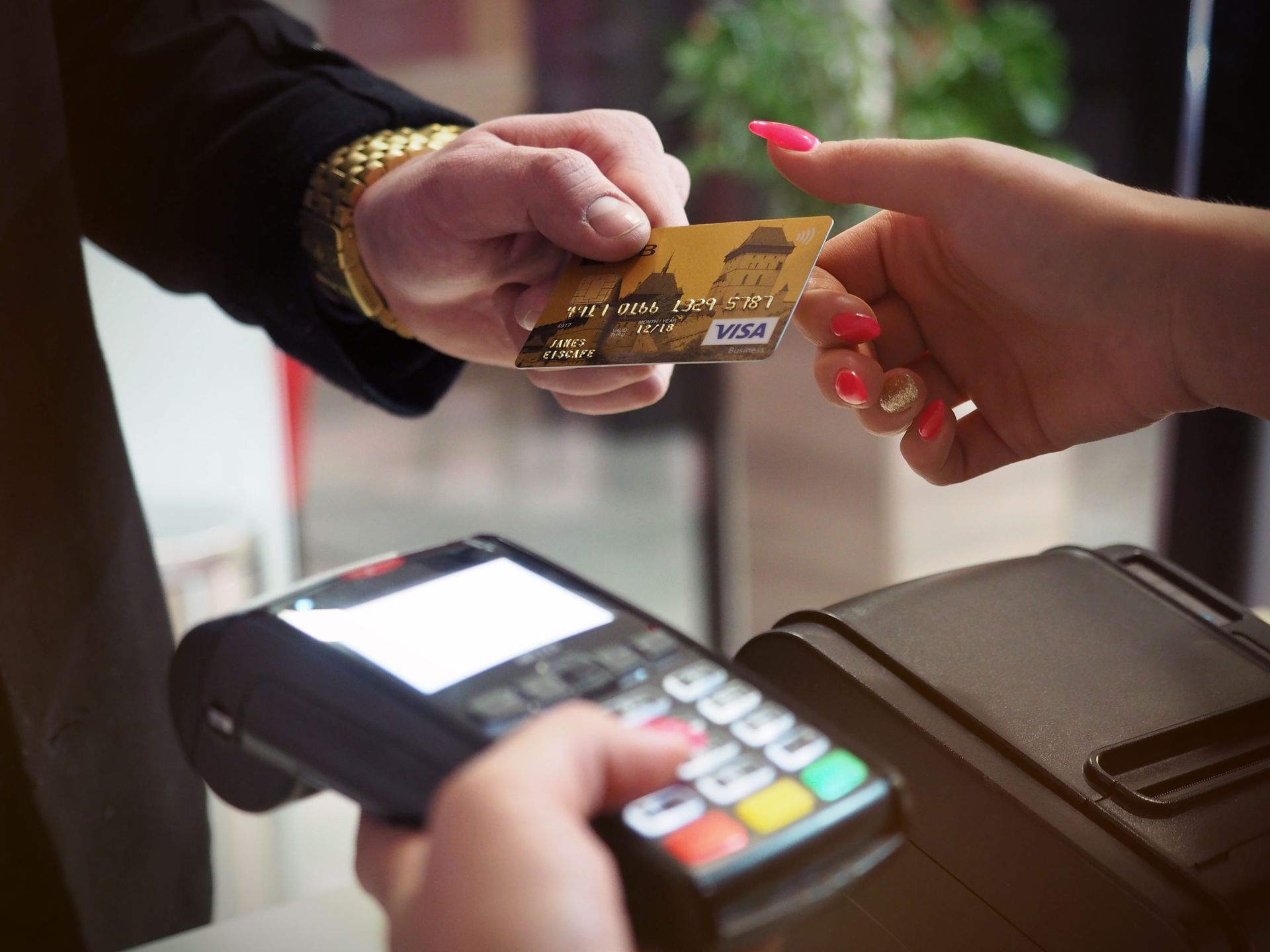 Customer paying by card at a terminal
