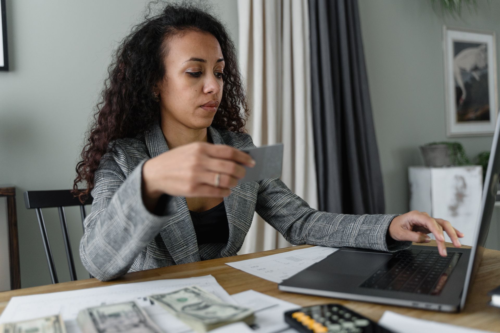 Managing household bills on a laptop