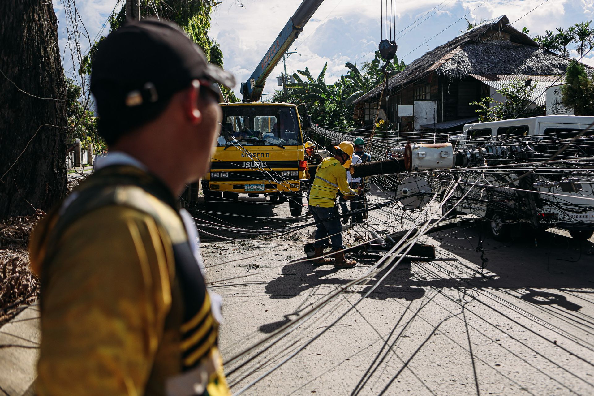 Utility crew fixing downed power lines