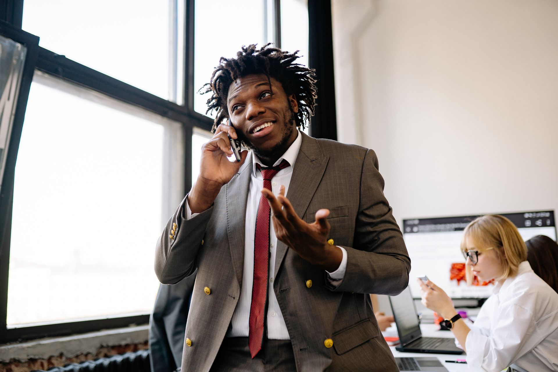 Insurance sales agent smiling on a phone call