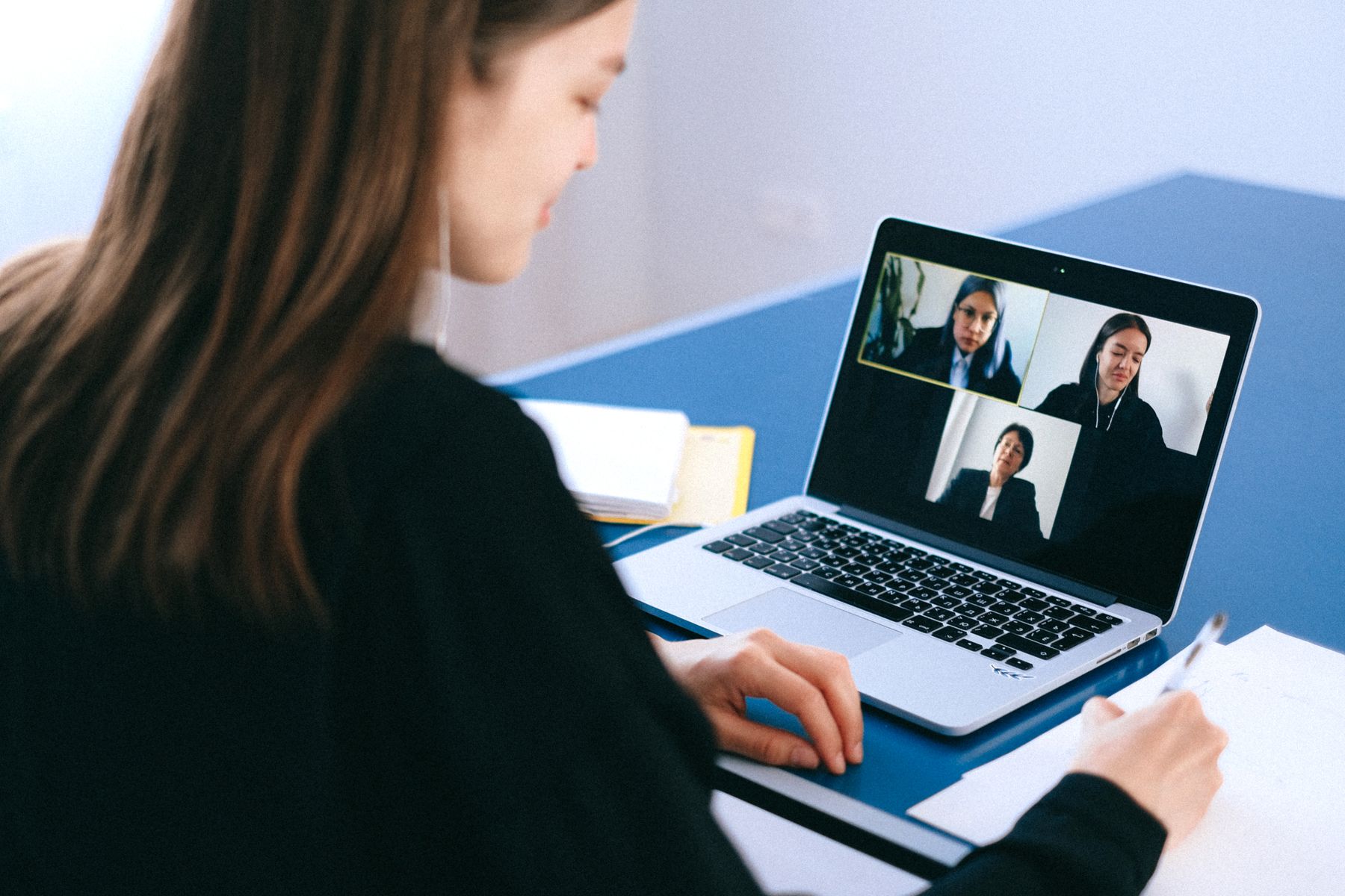 Team member on a multilingual video call with colleagues