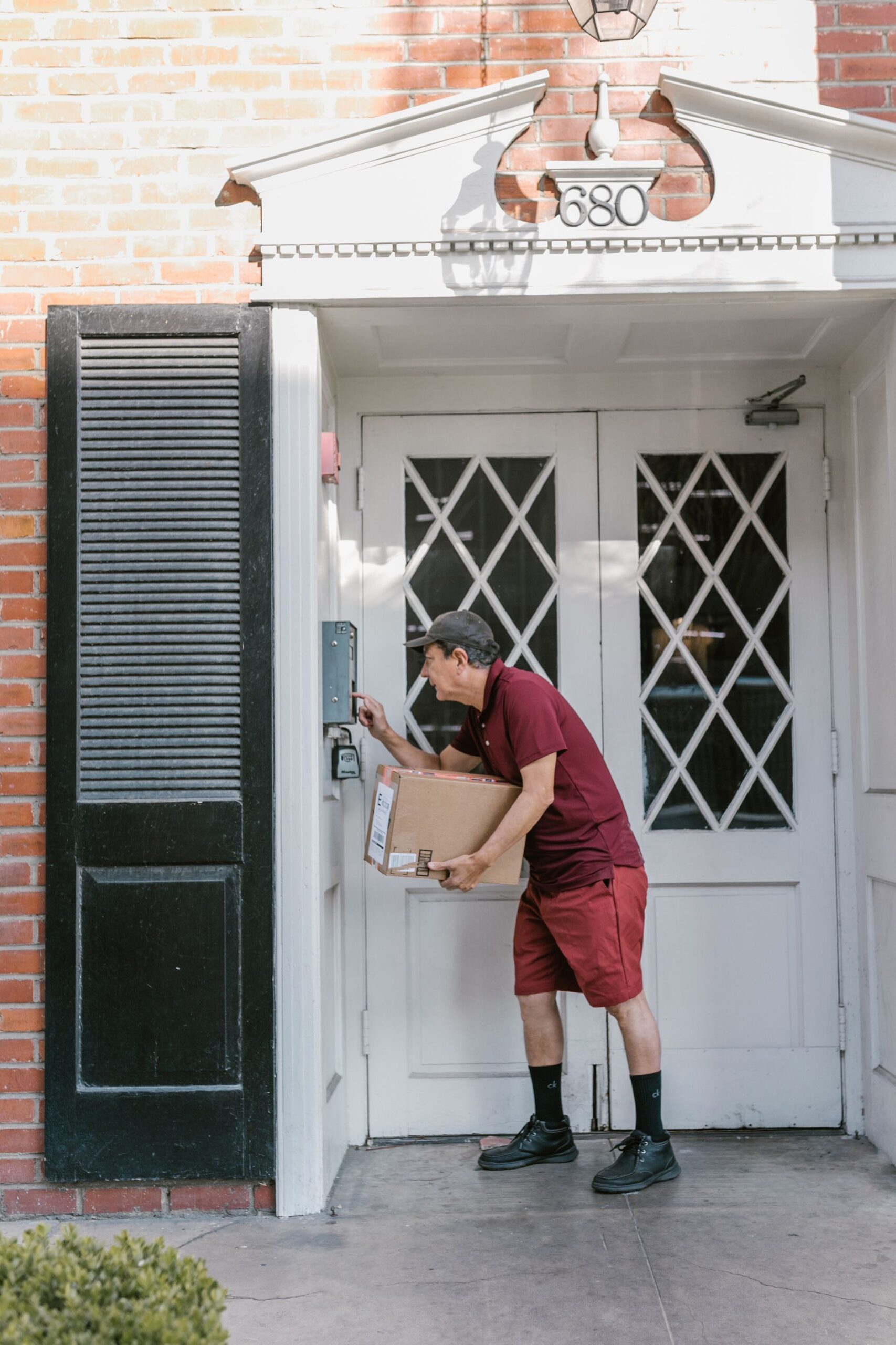 Courier delivering a package to a home