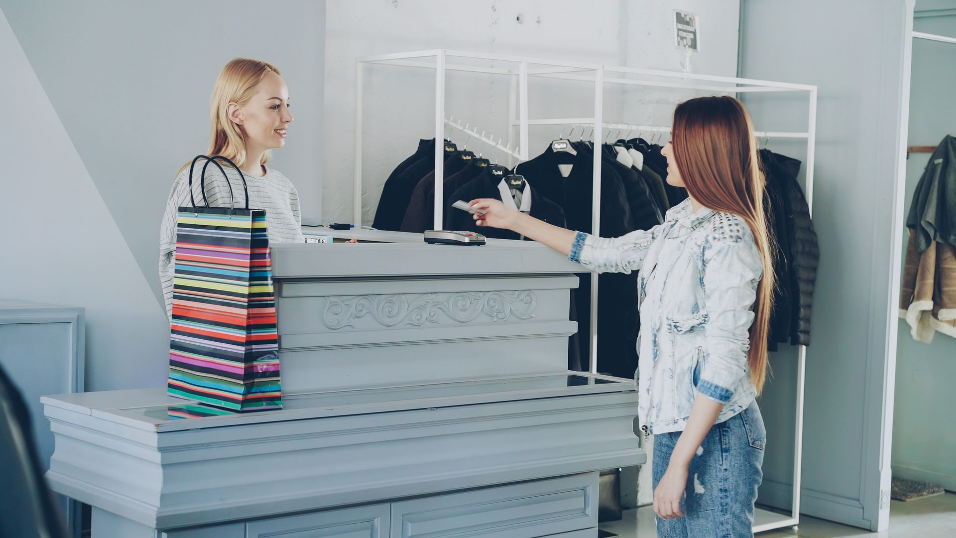 Customer paying at a store counter