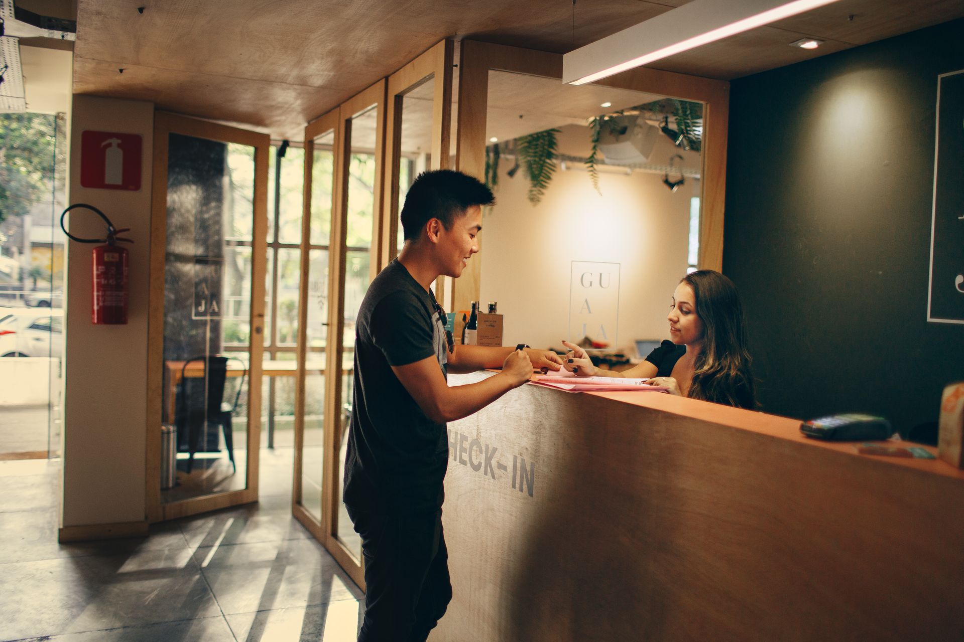 Guest checking in at a hotel reception
